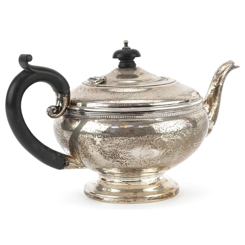 69 - G Bryan & Co, George V silver teapot with ebonised wood handle and knop, Birmingham 1932, 24cm in le... 