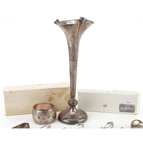 267 - Silver objects comprising seven teaspoons, napkin ring, sugar tongs and bud vase, the largest 19.5cm... 