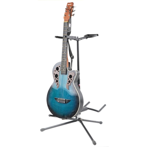 1679 - Melody six string acoustic guitar with Stagg guitar stand, the guitar 96cm in length