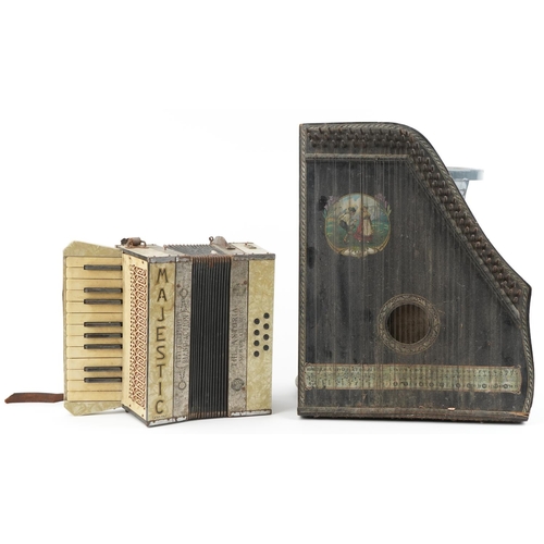 1694 - Two vintage German musical instruments comprising a Majestic accordion and ebonised zither