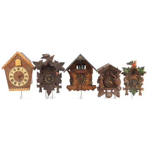 1377 - Four German carved Black Forest cuckoo clocks and a Russian USSR example by Veaga, the largest 30cm ... 