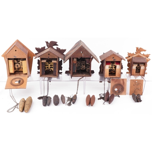 1377 - Four German carved Black Forest cuckoo clocks and a Russian USSR example by Veaga, the largest 30cm ... 