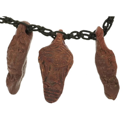 2784 - Tribal interest pottery figural necklace, 50cm in length