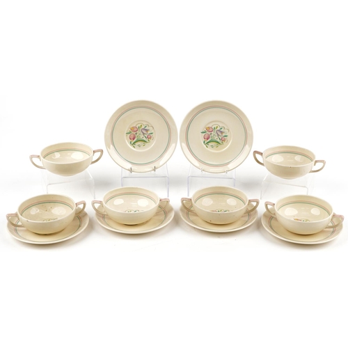 1539 - Set of six Susie Cooper twin handled soup bowls and saucers decorated with stylised flowers, each sa... 