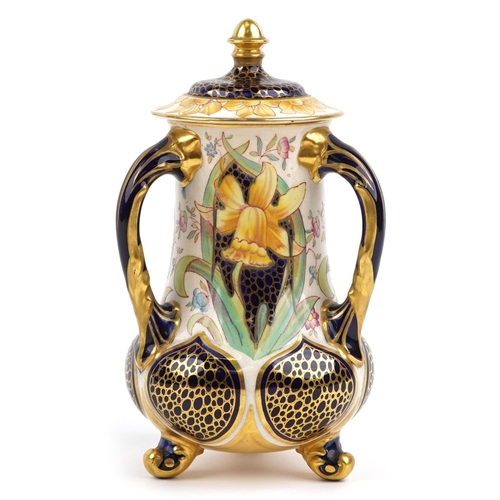 513 - Foley Wileman, Victorian aesthetic faience three handled vase and cover decorated with stylised daff... 