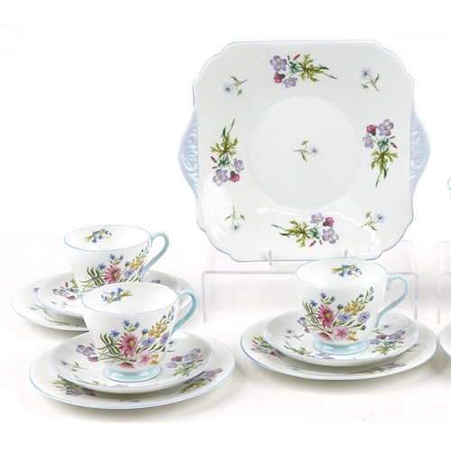 729 - Shelley Wild Flowers six place tea service comprising six trios, milk jug, sugar bowl and sandwich p... 