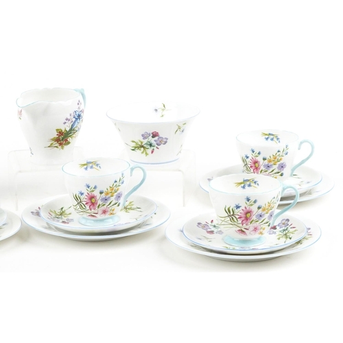 729 - Shelley Wild Flowers six place tea service comprising six trios, milk jug, sugar bowl and sandwich p... 