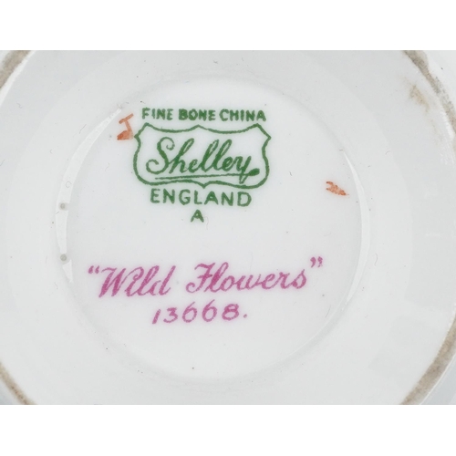 729 - Shelley Wild Flowers six place tea service comprising six trios, milk jug, sugar bowl and sandwich p... 