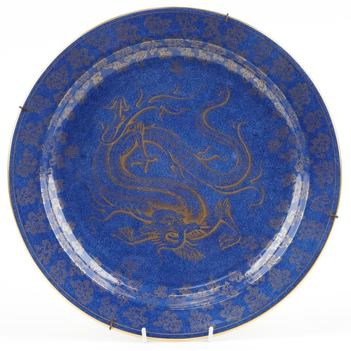 55 - Wedgwood, aesthetic Chinese style powder blue ground lustre wall plaque gilded with a dragon amongst... 