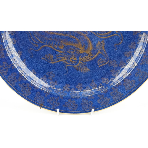 55 - Wedgwood, aesthetic Chinese style powder blue ground lustre wall plaque gilded with a dragon amongst... 
