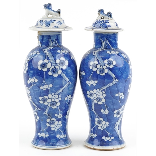 96 - Pair of Chinese blue and white porcelain baluster vases with unassociated covers, each hand painted ... 