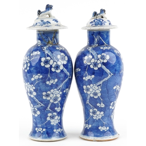 96 - Pair of Chinese blue and white porcelain baluster vases with unassociated covers, each hand painted ... 