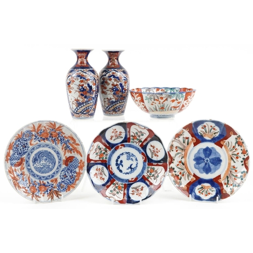 1422 - Japanese Imari porcelain including a pair of vases hand painted with flowers, the largest 19cm high