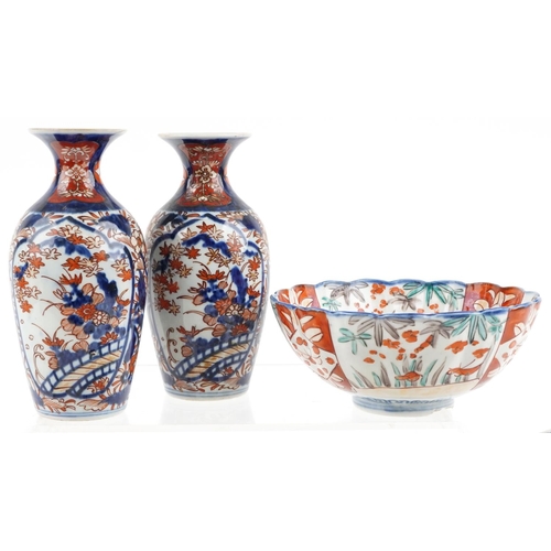 1422 - Japanese Imari porcelain including a pair of vases hand painted with flowers, the largest 19cm high