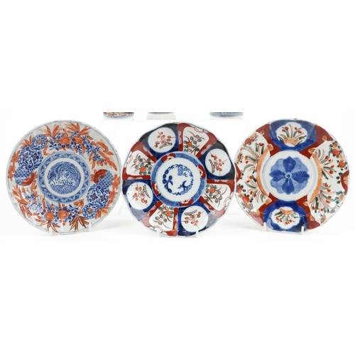 1422 - Japanese Imari porcelain including a pair of vases hand painted with flowers, the largest 19cm high