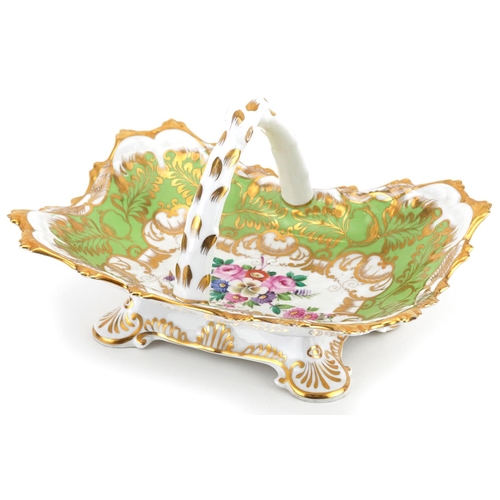 472 - 19th century Staffordshire green ground porcelain basket hand painted with flowers, 22cm wide