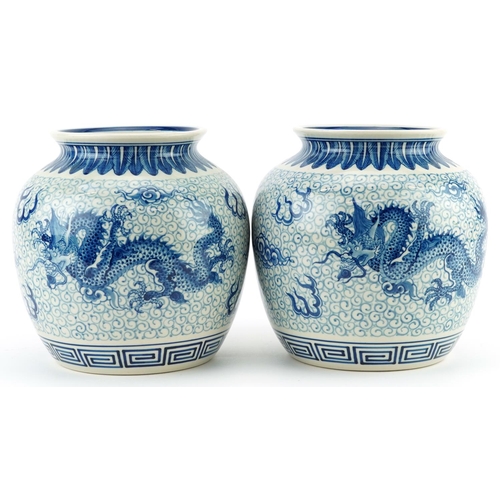 1533 - Pair of Chinese blue and white porcelain jar vases hand painted with dragons chasing the flaming pea... 