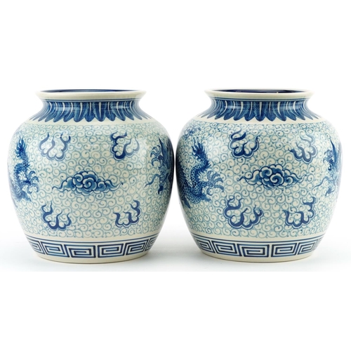 1533 - Pair of Chinese blue and white porcelain jar vases hand painted with dragons chasing the flaming pea... 