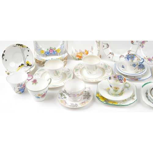 546 - Art Deco and later Shelley teaware including Mode Saucers and Tall Trees pattern saucers, the larges... 