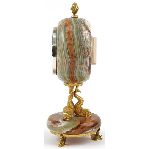 591 - Xavier of London, 19th century style onyx and gilt metal mantle clock with classical dolphin support... 