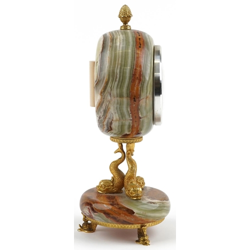 591 - Xavier of London, 19th century style onyx and gilt metal mantle clock with classical dolphin support... 