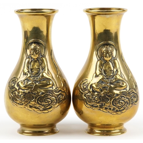 100 - Pair of Chinese patinated bronze vases, each decorated in relief with Buddha, each 25.5cm high