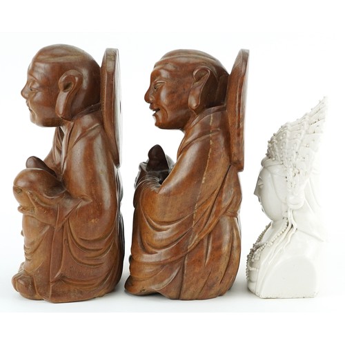 1511 - Pair of Chinese hardwood carvings of Buddha and blanc de chine glazed porcelain bust of Guanyin, the... 