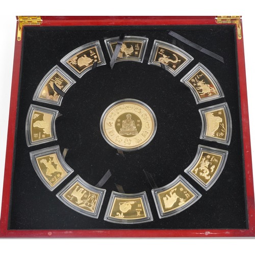 1547 - Set of Chinese zodiac ingots housed in a fitted box with protective box, 32cm x 32cm