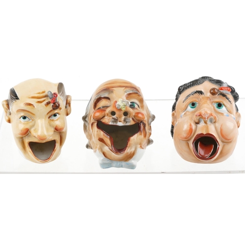 539 - Seven early 20th century smoking interest Japanese porcelain ashtrays in the form of comical heads, ... 