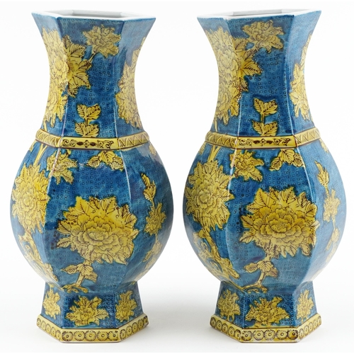 1396 - Pair of Chinese porcelain hexagonal blue ground vases hand painted with flowers, each 40cm high