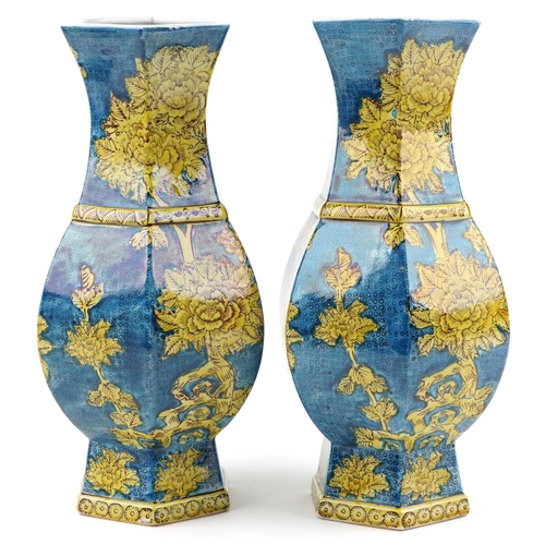 1396 - Pair of Chinese porcelain hexagonal blue ground vases hand painted with flowers, each 40cm high