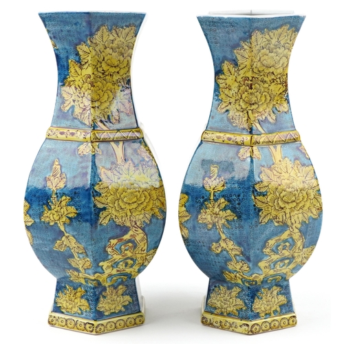 1396 - Pair of Chinese porcelain hexagonal blue ground vases hand painted with flowers, each 40cm high