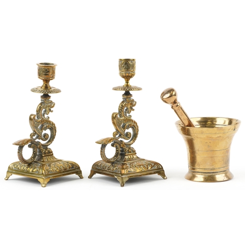 492 - Antique bronze pestle & mortar and pair of dragon design candlesticks, the largest 19,5cm high