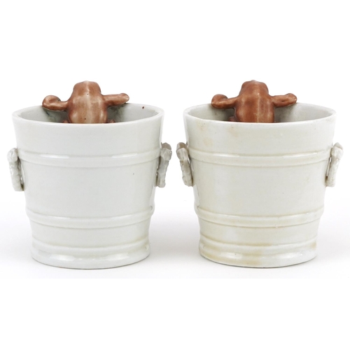 130 - Pair of 19th century continental porcelain comical cache pots in the form of buckets mounted with fr... 