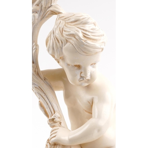 1403 - Classical plaster stand in the form of a nude Putti holding a cornucopia, 70cm high