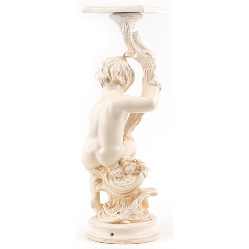 1403 - Classical plaster stand in the form of a nude Putti holding a cornucopia, 70cm high