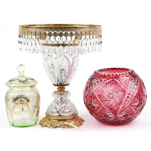 1398 - Glassware including Bohemian ruby overlaid cut glass vase and a glass and brass lamp with drops, the... 