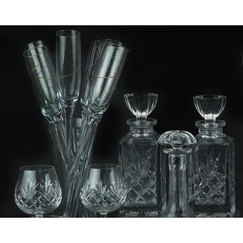 1404 - Glassware including Boyne Valley tumblers, three decanters and set of six Champagne flutes, the larg... 