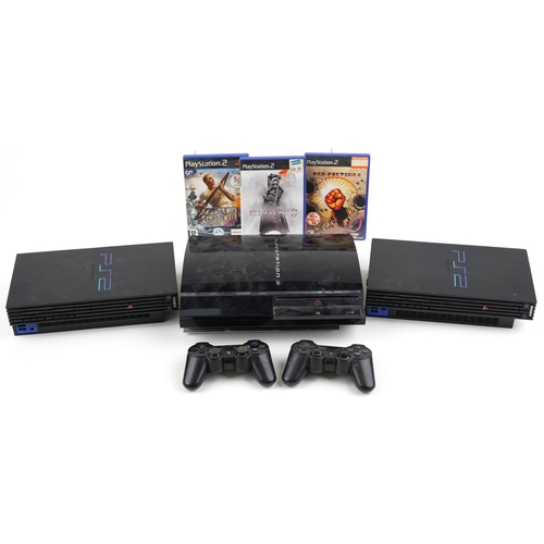 1596 - Sony PlayStation 3 games console with two controllers and two Sony PlayStation 2 games consoles with... 