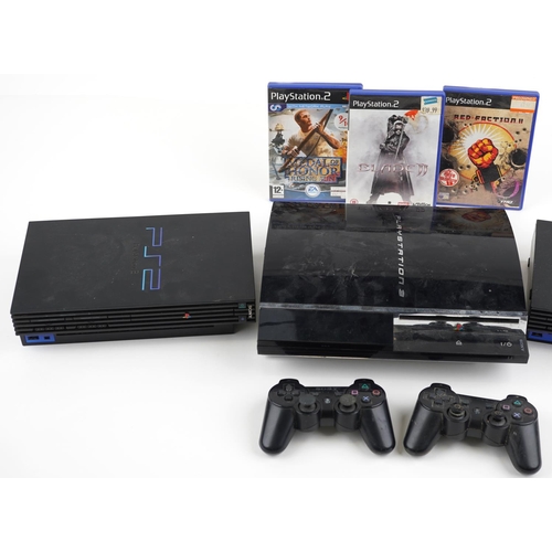 1596 - Sony PlayStation 3 games console with two controllers and two Sony PlayStation 2 games consoles with... 