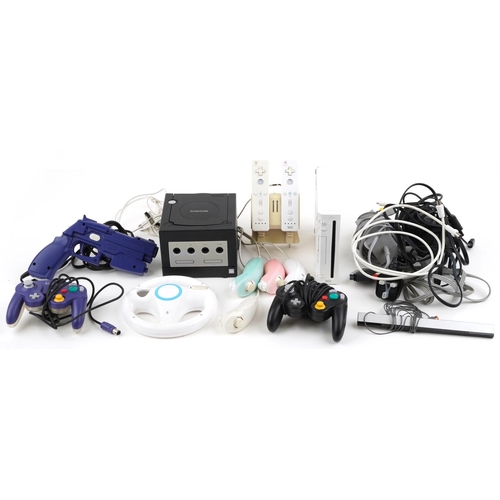 1595 - Nintendo Wii games console with controllers and accessories and a Nintendo Game Cube games console w... 