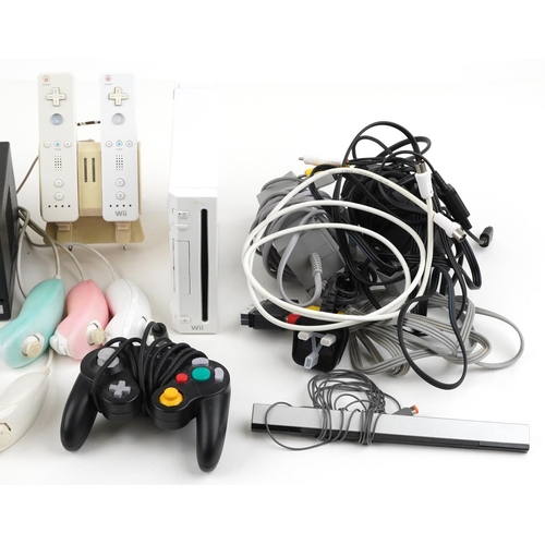 1595 - Nintendo Wii games console with controllers and accessories and a Nintendo Game Cube games console w... 