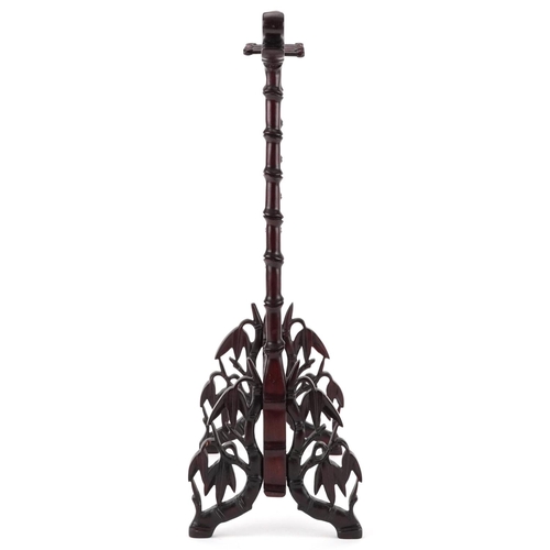 562 - Chinese hardwood faux bamboo brush hanger carved with dragon's heads, 38cm high