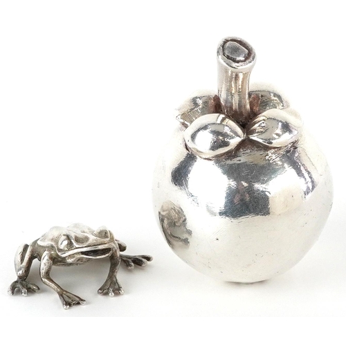 400 - Silver model of a seated frog and a silver filled model of a pome fruit, the largest 7.5cm high, tot... 