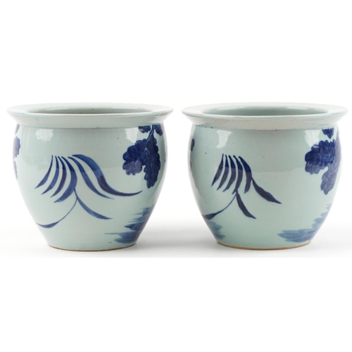 619 - Pair of Chinese blue and white porcelain jardinieres painted with children playing in a palace setti... 