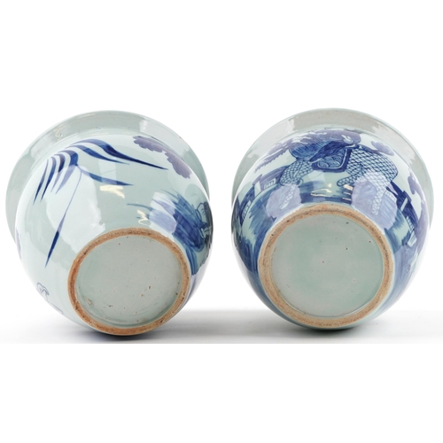 619 - Pair of Chinese blue and white porcelain jardinieres painted with children playing in a palace setti... 