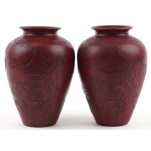 1261 - Pair of Chinese faux cinnabar lacquer porcelain vases incised with figures in a palace setting, each... 