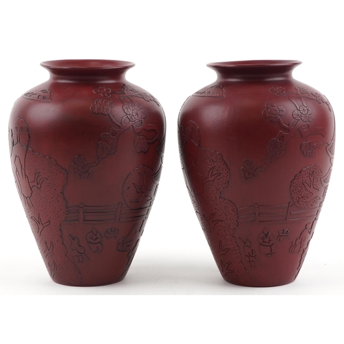 1261 - Pair of Chinese faux cinnabar lacquer porcelain vases incised with figures in a palace setting, each... 