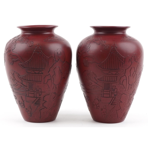 1261 - Pair of Chinese faux cinnabar lacquer porcelain vases incised with figures in a palace setting, each... 