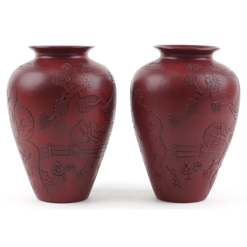 1261 - Pair of Chinese faux cinnabar lacquer porcelain vases incised with figures in a palace setting, each... 